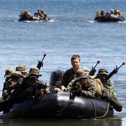 Philippine and US marines during an amphibious raid as part of a joint military exercise in Ulugan Bay in April. Photo: Reuters
