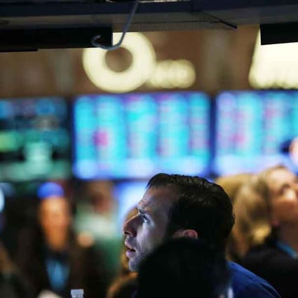 A trader works on the floor of the New York Stock Exchange. Photo: AFP