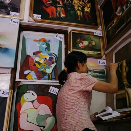 An artist seen at work in Dafen, Shenzhen. Photo: Samantha Sin