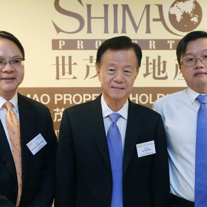 (Left to right) Shimao Property senior financial controller Ringo Yau, chairman Hui Wing-mau, and vice chairman Jason Hui, attend the company's AGM press conference in Wan Chai.