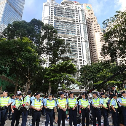Police officers stand in Chater Road after the sit-in on July 2. Photo: David Wong