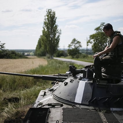 A Ukrainian soldier sits on an armoured vehicle at a position near Konstantinovka on Thursday. Photo: Reuters