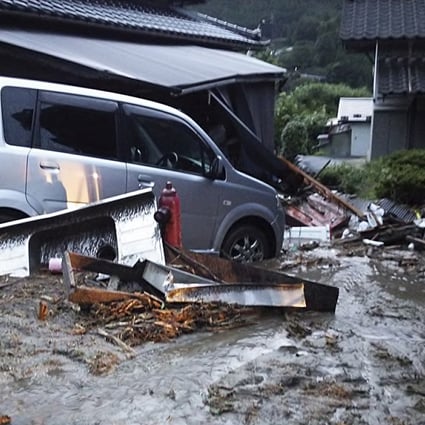 Cars and buildings damaged by a landslide caused by heavy rains set off by Typhoon Neoguri are seen in Nagiso. Photo: Reuters