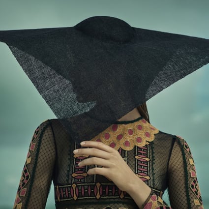 Embroidered lace dress (HK$53,500) by Valentino. Hat (HK$4,800) by Giorgio Armani.