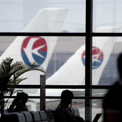 Mainland airlines including China Eastern, which have warned of sharp profit falls for the first half, may face further pressure from expected cuts in services. Photo: Bloomberg