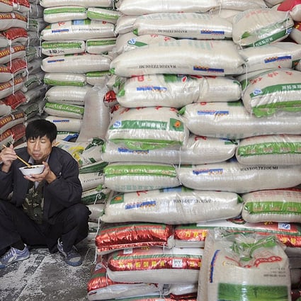 A customer shops for rice at a supermarket in Wuhan. Photo: Reuters