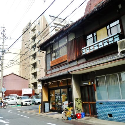Traditional houses mix with high-rise buildings in Kyoto, where strict building codes preserve architectural heritage. Photo: Fanny Fung