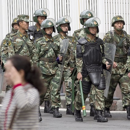 Police patrol in Urumqi in the wake of recent terror attacks. Photo: AP