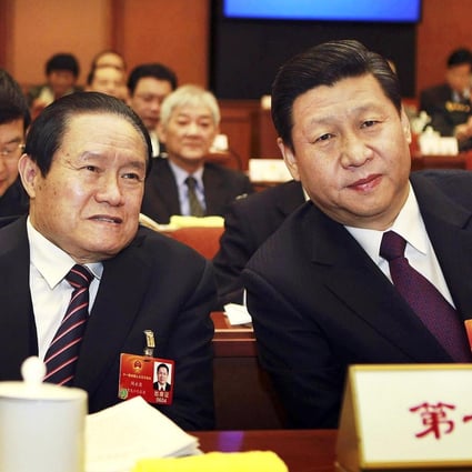 Zhou Yongkang (left) sits with Xi Jinping at the National People's Congress in 2012. Photo: CNS