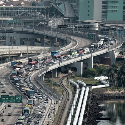 A massive jam disrupts traffic travelling into Singapore from Malaysia at the Johor Bahru checkpoint. Photo: AFP