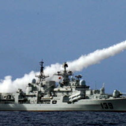 A Chinese warship fires a missile during a live ammunition drill in the South China Sea. Photo: Xinhua 
