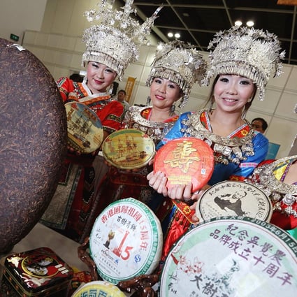 Wujuenong Tea staff in traditional costumes prepare for next week's International Tea Fair – part of the five-day Food Expo. Photo: Nora Tam