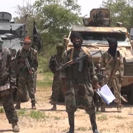 A July 13 screenshot from a video by the Nigerian Islamist extremist movement Boko Haram shows its leader, Abubakar Shekau (centre) making demands over young women abducted by the group. Photo: AFP