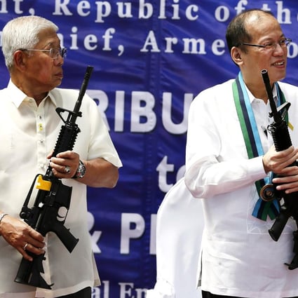 Philippine President Benigno Aquino (right), seen here with the defence secretary, may try to amend the constitution. Photo: EPA