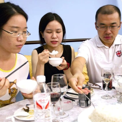 Diners try out GM rice at a tasting event in Beijing. Photo: Simon Song