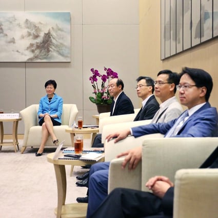 (From left) liaison office chief Zhang Xiaoming and host Chief Secretary Carrie Lam Cheng Yuet-ngor at the meeting in the government's Tamar offices yesterday with lawmakers Frederick Fung, Dr Joseph Lee Kok-long, Ip Kin-yuen and Charles Mok, and Undersecretary for Constitutional and Mainland Affairs Lau Kong-wah. Photo: Nora Tam