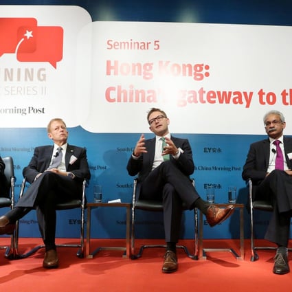 From left, the Post's William Zheng, EY's Bob Partridge, Ian Bolin from Infiniti, Digital Realty's Kris Kumar and Cathay Pacific's Rupert Hogg discuss the problems facing Hong Kong. Photo: Sam Tsang