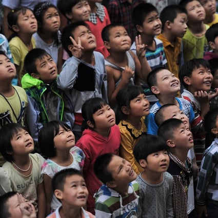 Students pose for a photo at a primary school for migrant children in Hefei, Anhui. Photo: Reuters