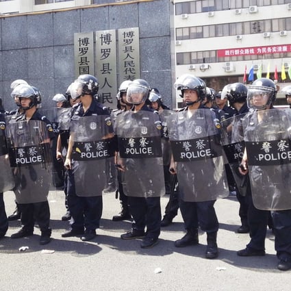 Police in anti-riot gear guard the government offices in Boluo county in Guangdong. The photo was provided by a rally participant who wished to remain anonymous. Photo: AP