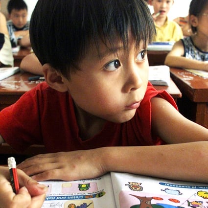 Sun Minyi, nine, attends an English class in Chongming county, north of Shanghai. Photo: Reuters