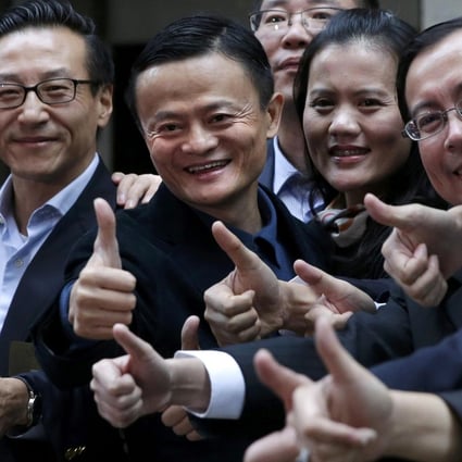 Alibaba founder Jack Ma (second from left) has plenty to smile about as he arrives at the New York Stock Exchange for the IPO. Photo: Reuters