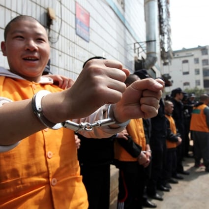 Gangsters arrested on economic crimes are paraded by Chinese police. Photo: AFP