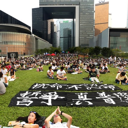 Hundreds of students sit at the open area of Tamar Park as they boycott class. Photo: Sam Tsang