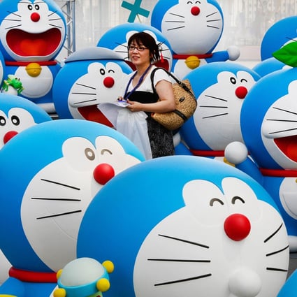 Life-size figures of Doraemon on the roof of the Tokyo Tower Foot Town on July 18, 2013. Photo: AFP
