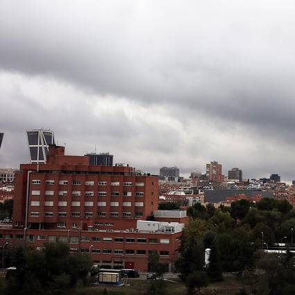 Rain clouds pass over Madrid's Carlos III Hospital, where Spanish nurse Teresa Romero Ramos who contracted Ebola is hospitalised with 16 others under observation. Photo: Reuters