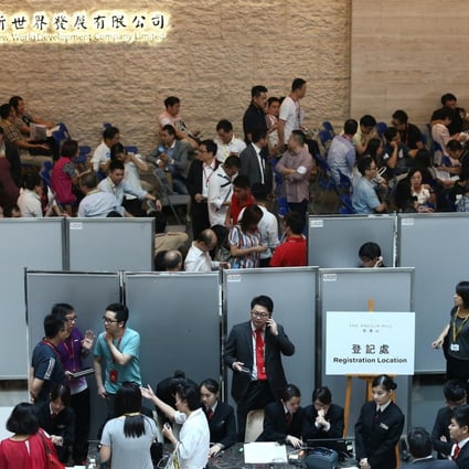 Potential buyers waiting at the sale office of the Pavilia in Tsuen Wan, which is developed by New World. Photo: Jonathan Wong