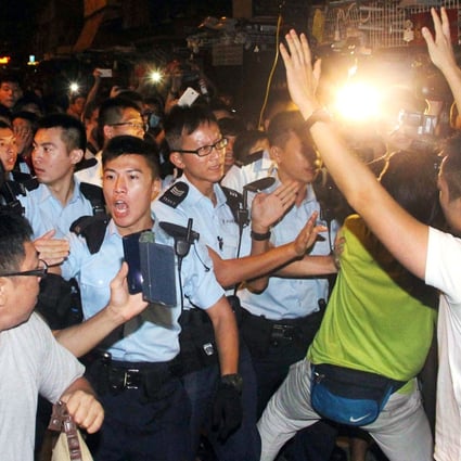 Police officers clash with pro-democracy protesters in Mong Kok. Photo: SCMP Pictures