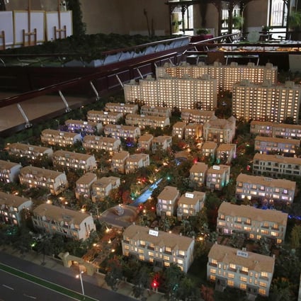 Mainland developers are struggling with loan repayments amid the weakness in the housing market, but property sales are expected to recover next year. Photo: Reuters