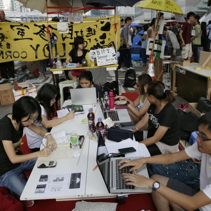 Pro-democracy students do their homework at a study area. Photo: AP