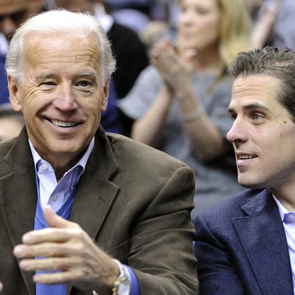 US Vice-President Joe Biden and son Hunter (right) appear at the Duke Georgetown NCAA college basketball game in Washington in 2010. Photo: AP