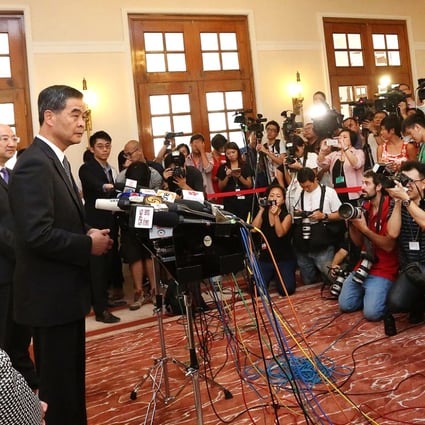 Chief Secretary Carrie Lam, Secretary for Constitutional and Mainland Affairs Raymond Tam, and Chief Executive Leung Chun-ying speak to the press at Government House. Photo: Felix Wong