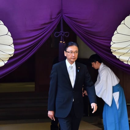 Japanese former state minister Keiji Furuya leaves the Yasukuni shrine on Friday. More than 100  lawmakers visited the shrine condemned by China and Korea as a symbol of Japan's militarist past. AFP