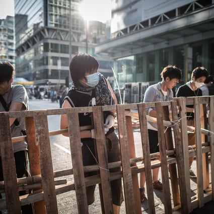 Pro-democracy protesters reinforce a barricade in Mong Kok. Photo: AFP