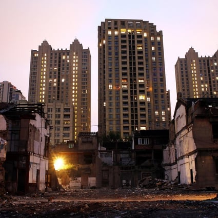 Houses being demolished to make way for new homes in Shanghai even as prices fell for the fifth month across the mainland. Photo: Reuters