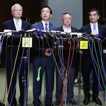 James Tien (centre) announces his resignation as Liberal Party leader flanked by lawmakers (from left) Frankie Yick Chi-ming, Vincent Fang Kang, Tommy Cheung Yu-yan and Chung Kwok-pan. Photo: Sam Tsang