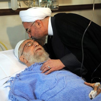 President Hassan Rowhani kisses Ayatollah Khameneion a hospital visit. Photo: EPA