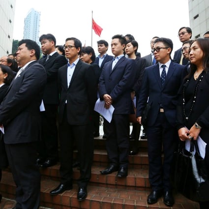 Lawyers stand in silence outside the High Court to condemn Occupy protesters ignoring several court injunctions. Photo: Sam Tsang