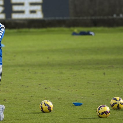 Real Sociedad coach David Moyes stands with coloured balls during a training session. Photo: AP