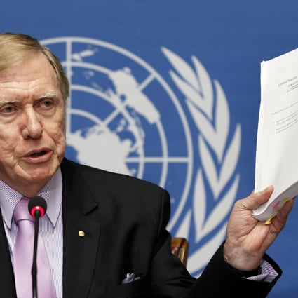 Michael Kirby, Chairman of the Commission of Inquiry on Human Rights in North Korea, shows a report on the human rights violations in North Korea during a press conference. Photo: EPA