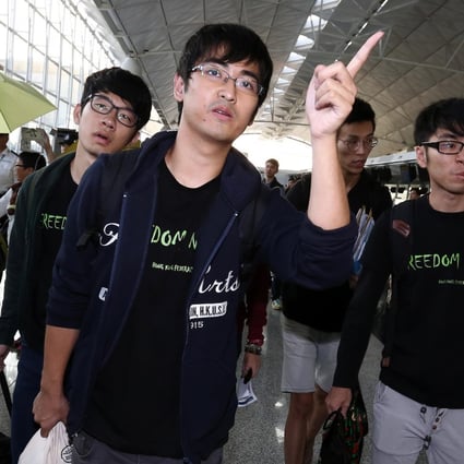 Nathan Law, Alex Chow and Eason Chung at Hong Kong airport after being banned from flying. Photo: Jonathan Wong