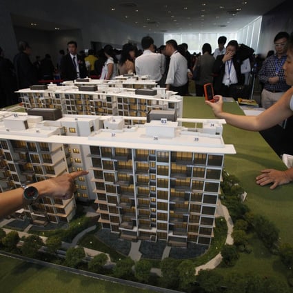 The government says there is some distance to go for Singapore's home prices to achieve "a meaningful correction". Photo: Reuters