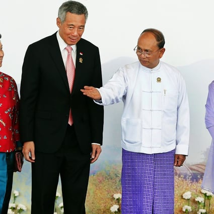 Singapore's Prime Minister Lee Hsien Loong (second left) and his wife Ho Ching (left) are welcomed by Myanmar's President Thein Sein (second right) and his wife Khin Khin Win before the opening ceremony of the 25th Association of Southeast Asian Nations (ASEAN) summit in Naypyitaw. Photo: Reuters
