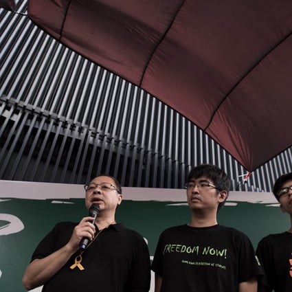 Occupy Central co-founder Benny Tai with Hong Kong student leaders Alex Chow and Joshua Wong. Occupy volunteers, students and pan-democrat lawmakers will be stationed at 21 locations across the city to share their views on universal suffrage.