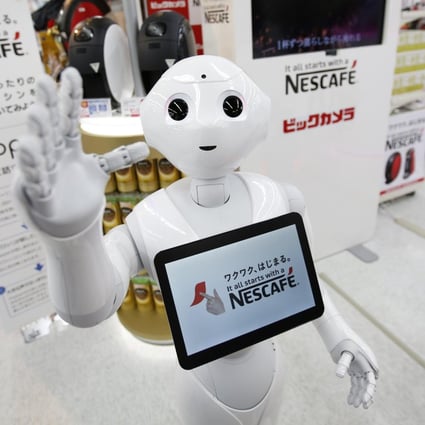 Robot "Pepper" introduces coffee machines. Photo: Reuters