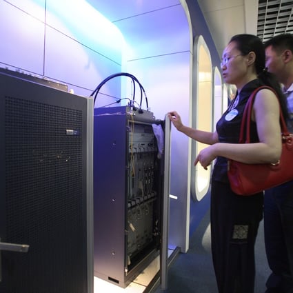Visitors look at the broadband equipment of ZTE in Shanghai, China. The plan by Beijing to widen participation in the country's fixed-line broadband market may falter. Photo: Bloomberg