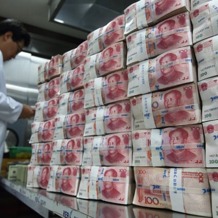 Stacks of Chinese yuan notes are seen as the implied guarantee of the People's Bank of China is said to be intact as Beijing seeks to maintain social calm. Photo: Bloomberg